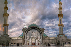 A front view image capturing the majestic facade of the Federal Territory Mosque in Kuala Lumpur, Malaysia