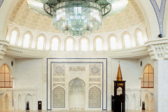 An image capturing the inside of the Federal Territory Mosque in Kuala Lumpur, Malaysia, where the Imam leads the prayer